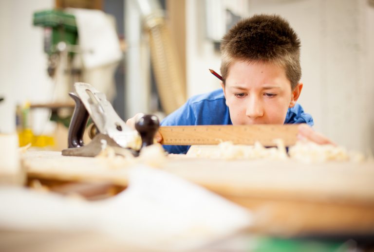 Boy in woodwork class